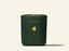 Dark green candle with 'CANOPY' branding on a light beige background