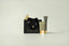 Canopy skincare products including a black gift bag, tube, and jar on a light gray background