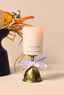 ORANGE CANDLE WITH SLICES OF ORANGE ON PLINTH CANOPY BEAUTY SKINCARE HOME RANGE 