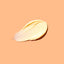  smear of cream on a peach background